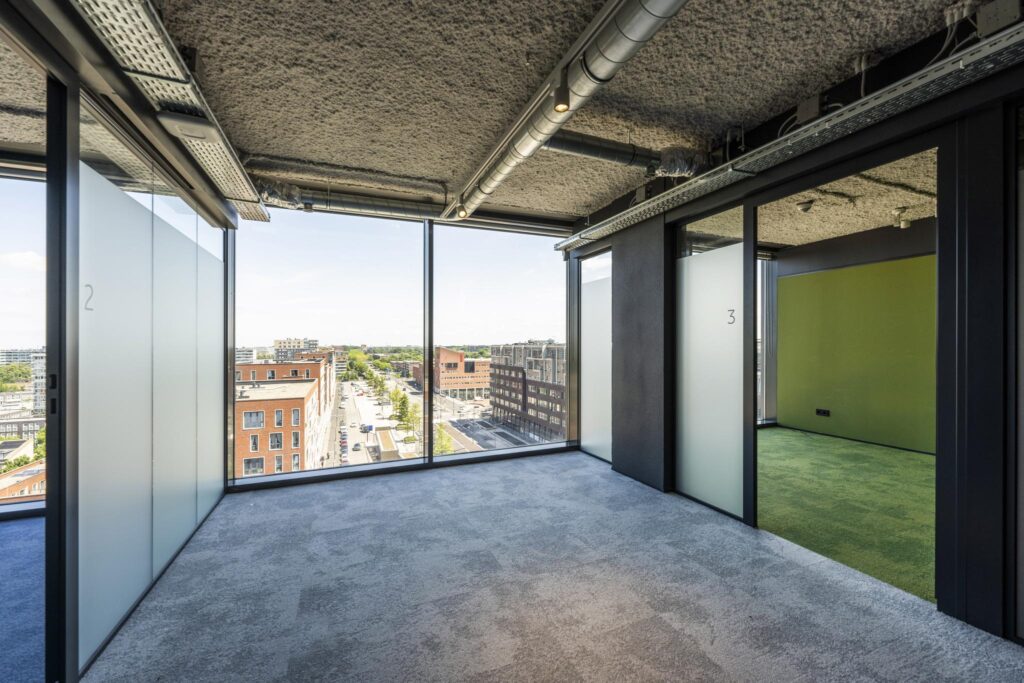 Modern office spaces with large windows overlooking Elizabeth Cady Stantonplein.
